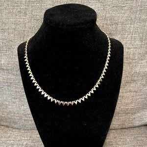 Gold tone necklace with triangles